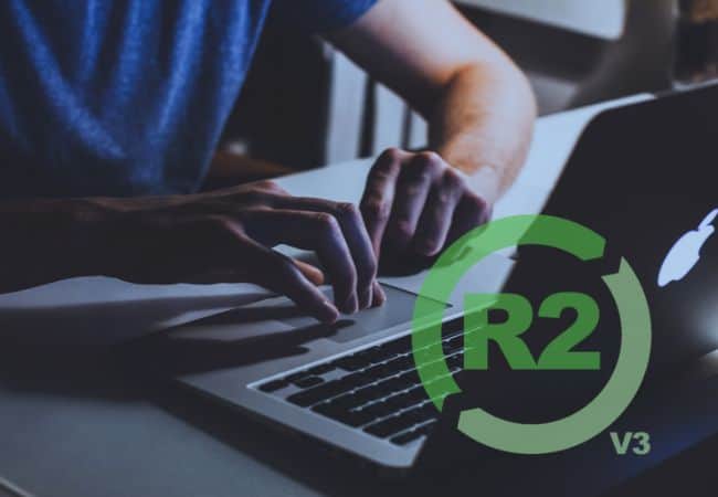 hands typing on macbook